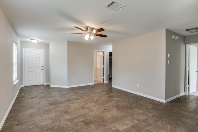 spare room with ceiling fan