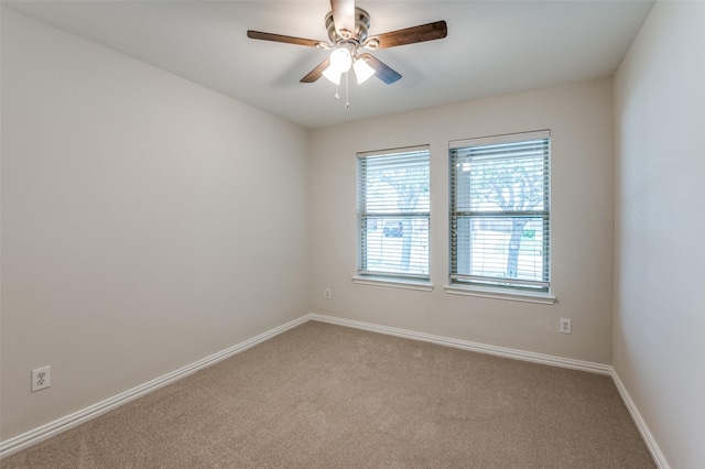 carpeted empty room with ceiling fan