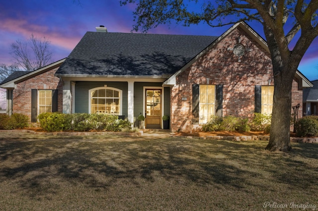 view of front of home with a yard