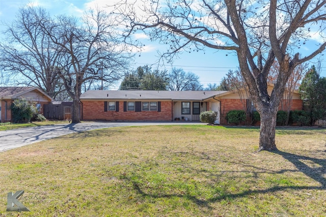 ranch-style home featuring a front yard