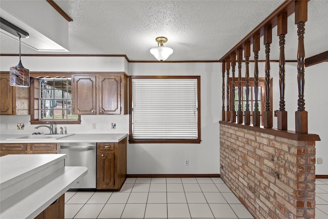 5570 Bretwood Dr, Keithville, LA 71047 - kitchen with light tile patterned floors, dishwasher, a textured ceiling, and sink