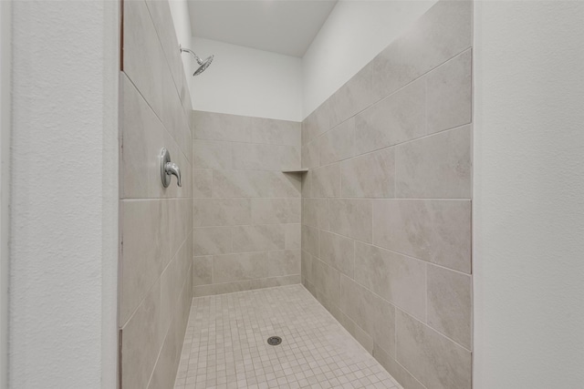 full bathroom with tiled shower