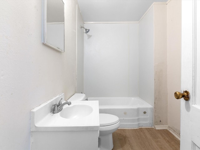 bathroom with hardwood / wood-style flooring, sink, and toilet