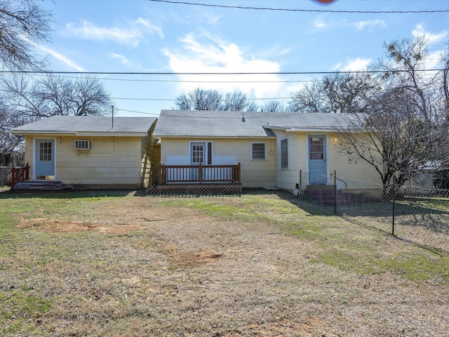 view of front of house with a wooden deck and a front yard