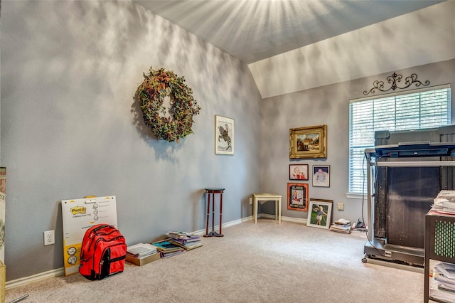 recreation room featuring vaulted ceiling, carpet, and baseboards