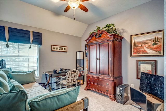 interior space featuring lofted ceiling, ceiling fan, and light colored carpet