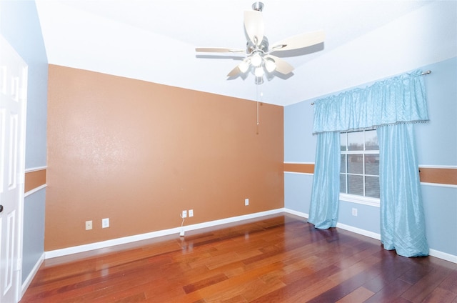 unfurnished room with ceiling fan and wood-type flooring