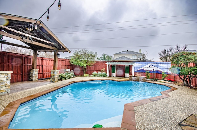 view of swimming pool with pool water feature