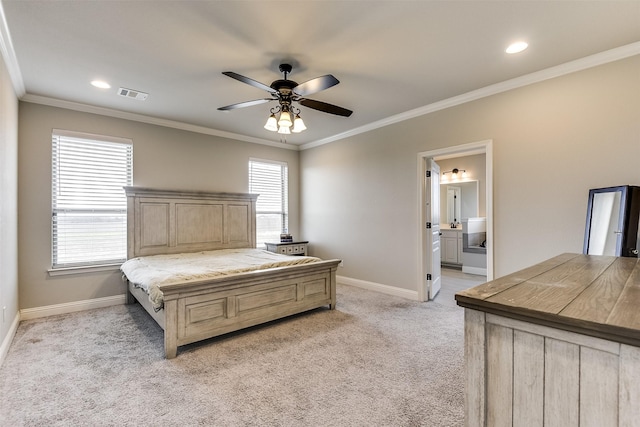 carpeted bedroom featuring ensuite bathroom, multiple windows, crown molding, and ceiling fan