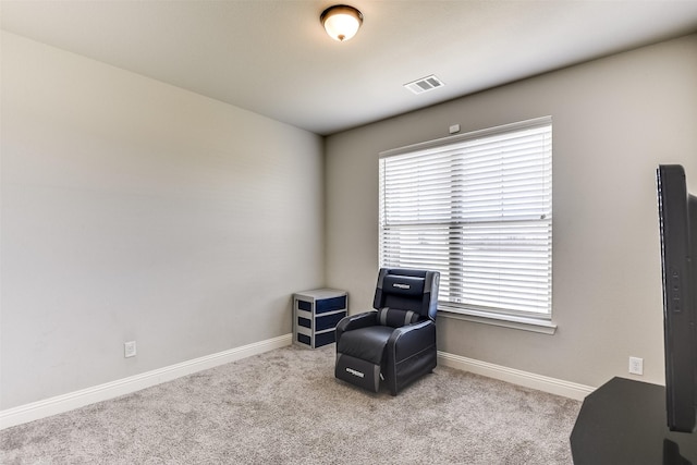 living area with light colored carpet