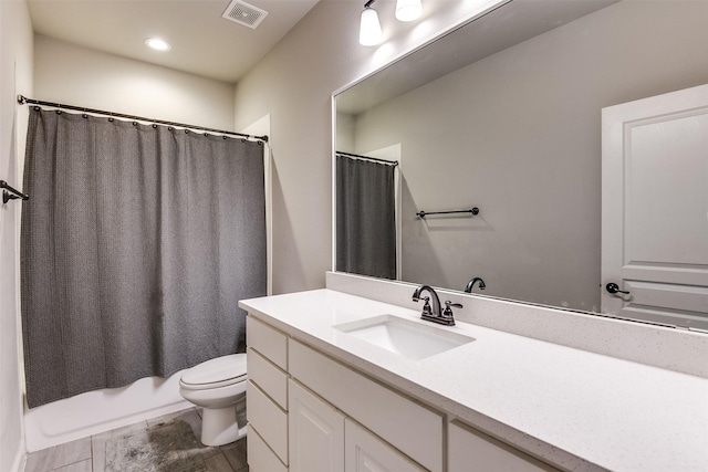 full bathroom featuring toilet, vanity, and shower / bathtub combination with curtain