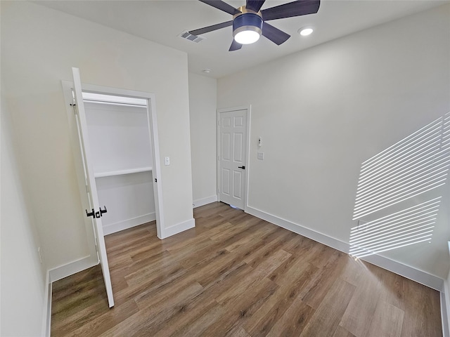 unfurnished bedroom with hardwood / wood-style flooring and ceiling fan