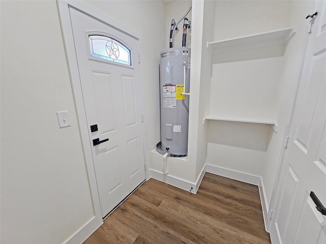 utility room featuring electric water heater