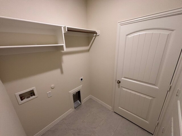 laundry room featuring laundry area, electric dryer hookup, hookup for a gas dryer, washer hookup, and baseboards