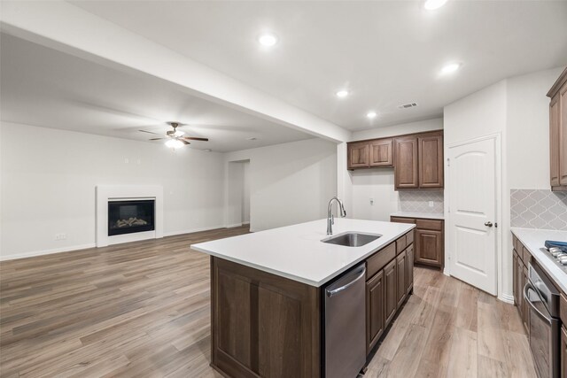 14317 Nebula Dr, Haslet, TX 76052 - unfurnished living room featuring a fireplace, baseboards, a ceiling fan, and wood finished floors