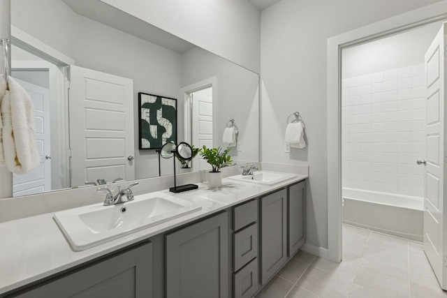 bathroom featuring tile patterned floors, bathtub / shower combination, and vanity