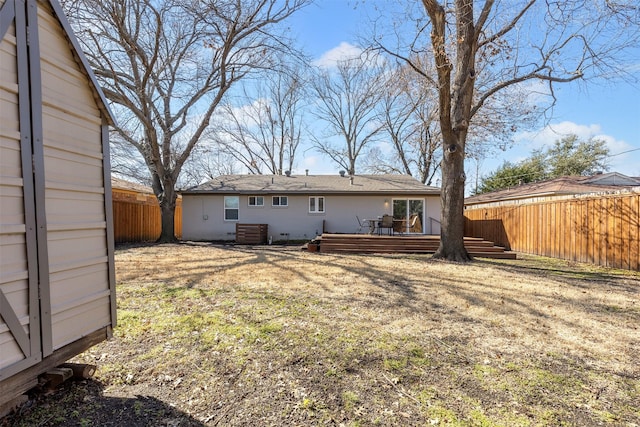 back of house with cooling unit, a fenced backyard, a lawn, and a deck