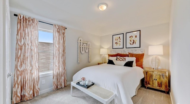 bedroom featuring light colored carpet