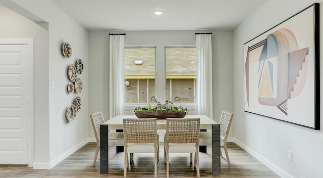 dining area featuring light wood-type flooring