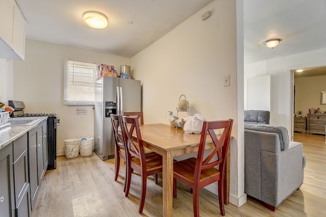 dining area with light hardwood / wood-style flooring