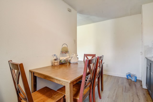 dining area with light hardwood / wood-style floors