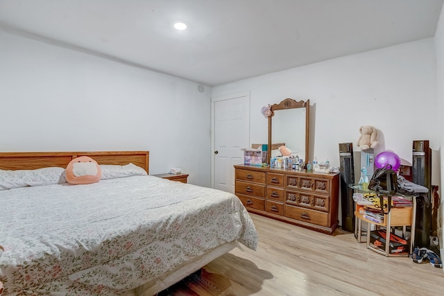 bedroom with light hardwood / wood-style flooring