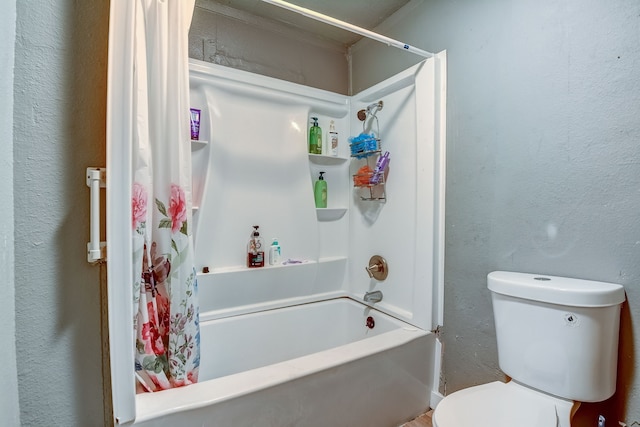 bathroom featuring toilet and shower / bath combo