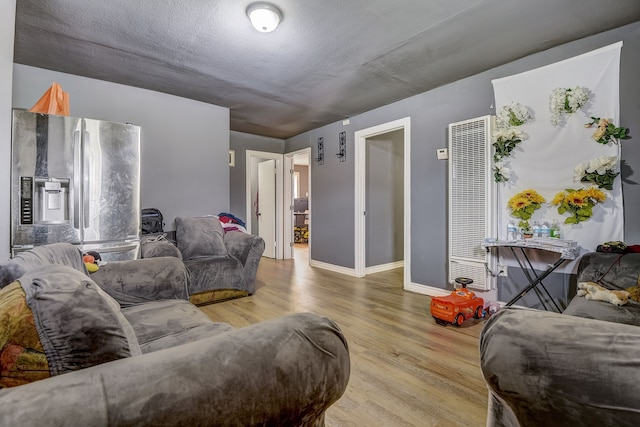 living room with light hardwood / wood-style flooring