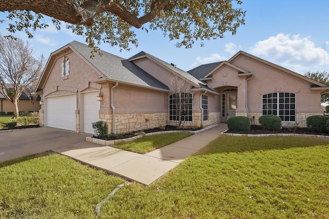 view of front of home with stucco siding, a shingled roof, concrete driveway, stone siding, and a front lawn