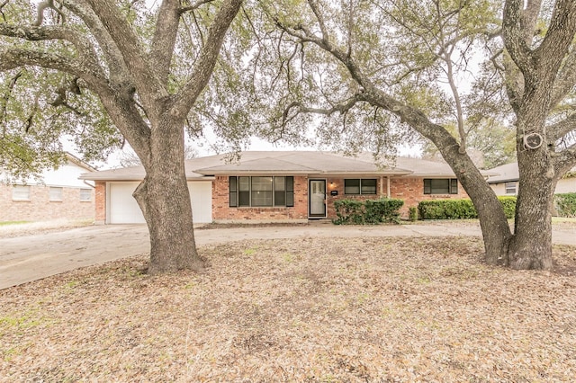 ranch-style home featuring a garage