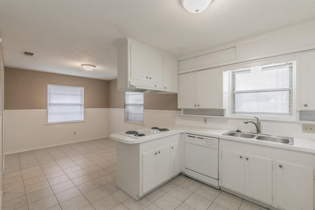 kitchen with white appliances, light tile patterned floors, sink, white cabinetry, and kitchen peninsula