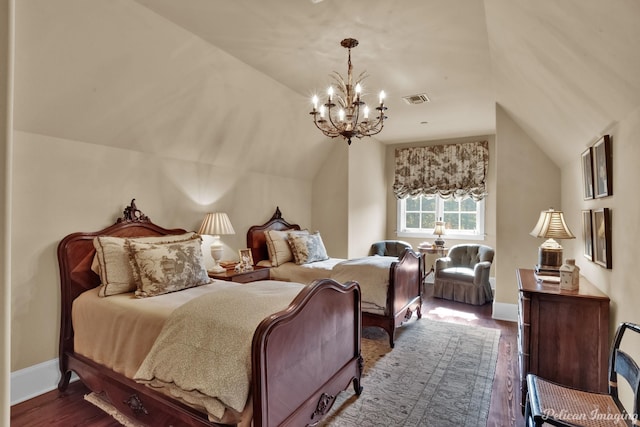 bedroom with a chandelier, wood-type flooring, and lofted ceiling