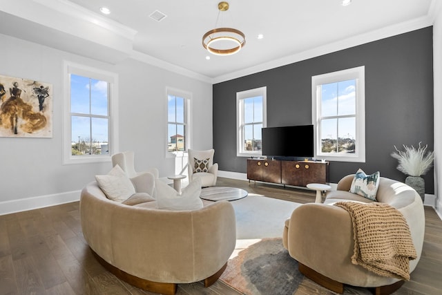 living room featuring dark wood-type flooring, recessed lighting, baseboards, and ornamental molding