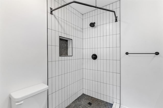 821 Dublin Dr Unit 143, Richardson, TX 75080 - bathroom featuring toilet and tiled shower