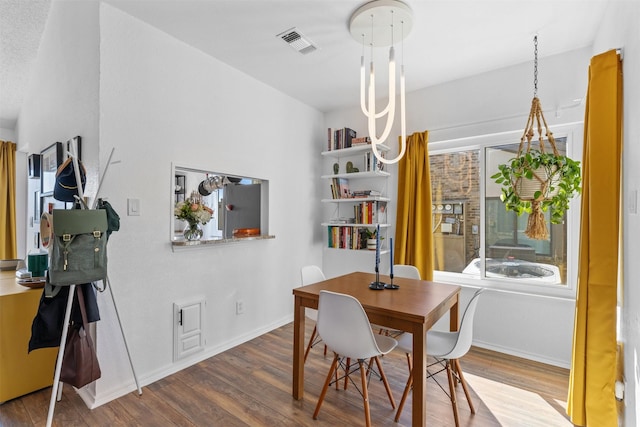 821 Dublin Dr Unit 143, Richardson, TX 75080 - dining area featuring baseboards, visible vents, plenty of natural light, and wood finished floors