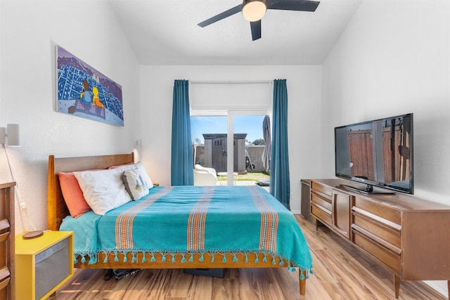 821 Dublin Dr Unit 143, Richardson, TX 75080 - bedroom featuring vaulted ceiling, light wood-style flooring, access to outside, and a ceiling fan