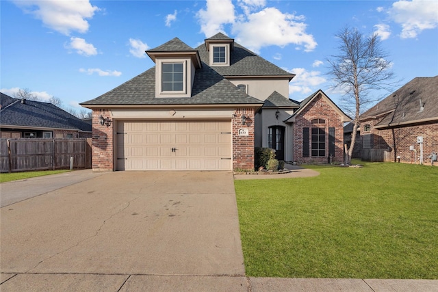 view of front property featuring a garage and a front yard