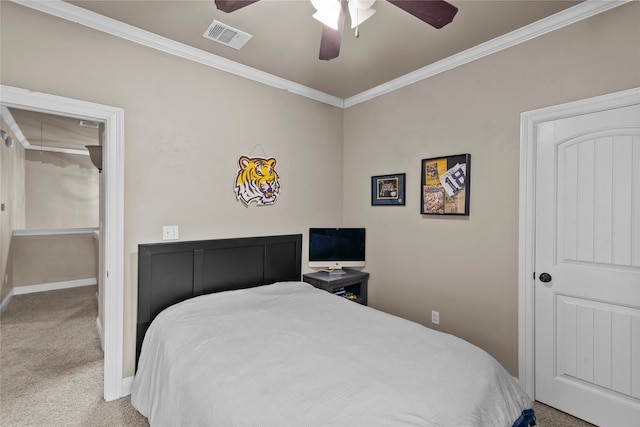 bedroom with carpet, ceiling fan, and ornamental molding