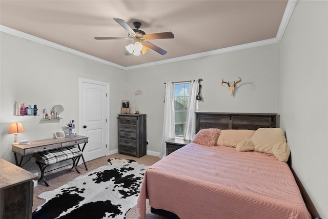 carpeted bedroom featuring ceiling fan and crown molding