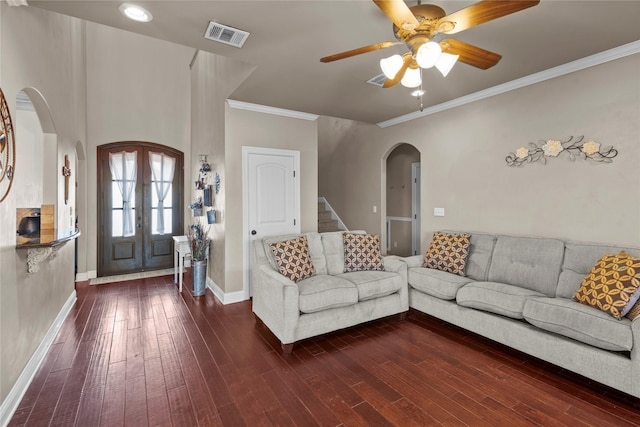 living room with dark hardwood / wood-style flooring, ornamental molding, french doors, and ceiling fan