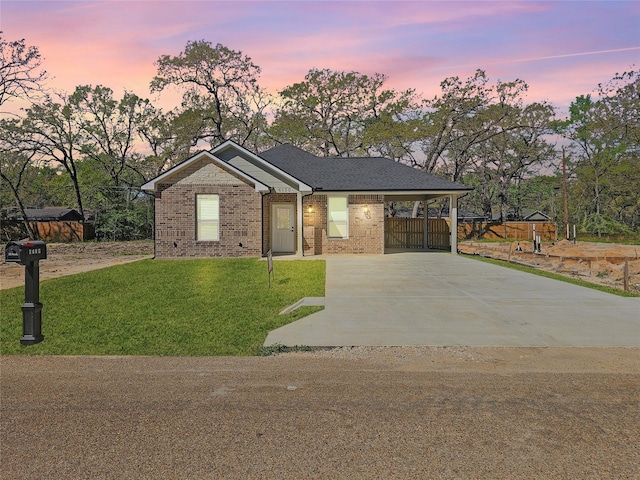 6130 Inca Dr, Mabank, TX 75156 - single story home with fence, driveway, brick siding, an attached carport, and a yard