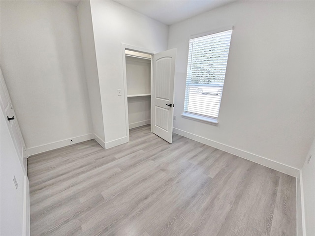 6130 Inca Dr, Mabank, TX 75156 - unfurnished bedroom featuring a closet, baseboards, and light wood-type flooring