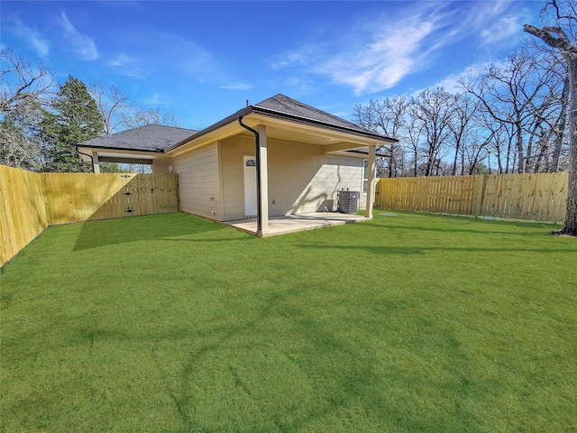 6130 Inca Dr, Mabank, TX 75156 - rear view of house featuring a patio, a fenced backyard, a lawn, a shingled roof, and cooling unit