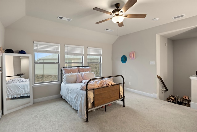 carpeted bedroom featuring vaulted ceiling and ceiling fan