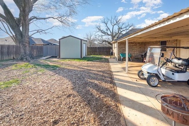 622 Brockett St, Aubrey, TX 76227 - fenced backyard with a storage unit and an outdoor structure