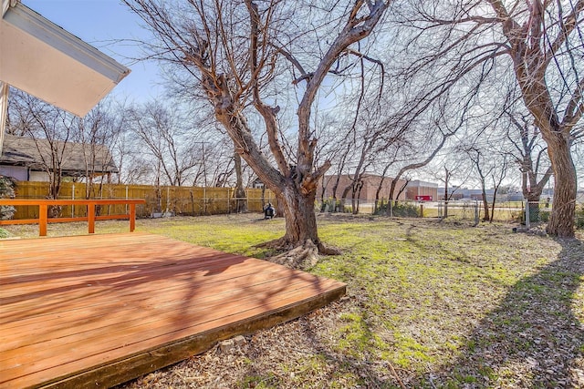 view of yard featuring a fenced backyard and a deck