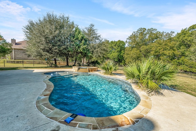 view of pool with an in ground hot tub and a patio