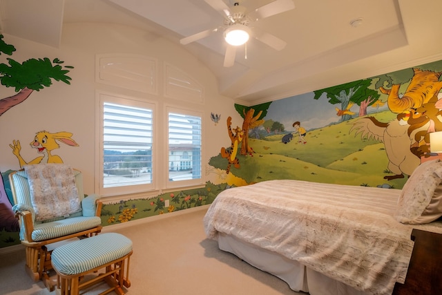 bedroom with a tray ceiling, ceiling fan, carpet, and lofted ceiling