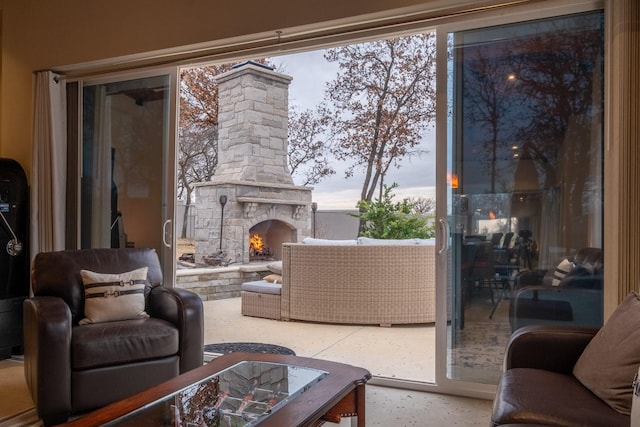 living room with an outdoor stone fireplace