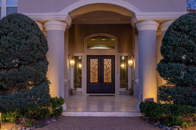 entrance to property featuring french doors